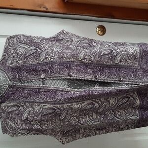 Paisley purple top with purple shell buttons and looped closures.